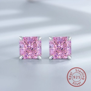 Macro shot of pink square-cut gemstones in S925 sterling silver four-prong stud earrings