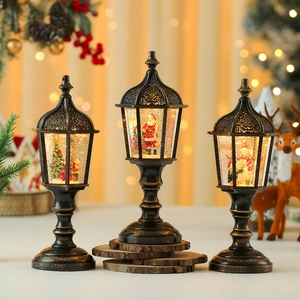 Three vintage Christmas lanterns with Santa and snowman scenes with warm LED lighting