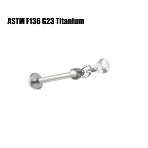 Close-up of G23 titanium labret stud featuring a teardrop-shaped cubic zirconia stone