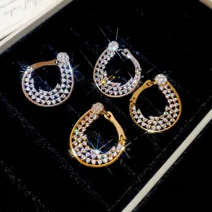 Boucles d'oreilles créoles goutte en or 18K et argent avec zircons étincelants