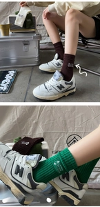 Detail of high-elastic ribbed cuffs with mountain embroidery on vintage cotton crew socks