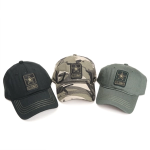 Detailed view of U.S. ARMY embroidery on camouflage and olive green military baseball caps