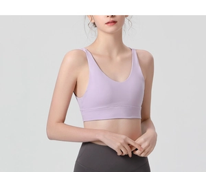 Detail of lavender V-neck sports bra featuring a seamless shockproof yoga design