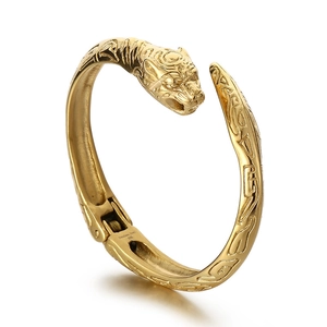 Golden stainless steel tiger head open bracelet with detailed animal relief and texture
