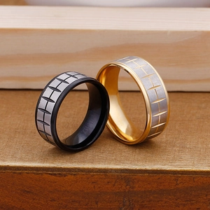 Black and gold tire tread pattern titanium steel rings with brushed metal texture