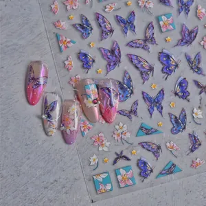 Detail of purple butterfly and flower nail stickers with 3D crystal accents on nails