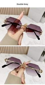Detail of rimless geometric sunglasses with double grey lenses and gold C-shaped hinges