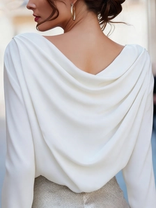 Elegant back view of white draped V-neck blouse showing smooth pleated texture