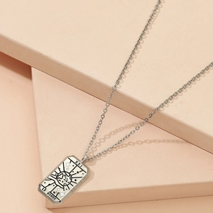 Vintage silver The World tarot card necklace featuring XXI Le Monde engraved pendant
