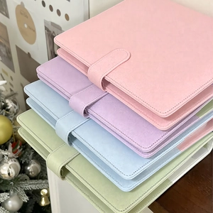 Close-up of colorful PU leather binders featuring macaron colors and button buckle closure