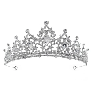 Silver bridal tiara featuring sparkling crystal rhinestones and elegant pointed peaks