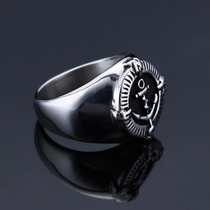 Macro view of vintage stainless steel anchor ring with black embossed nautical details