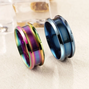 Macro view of rainbow and blue surgical steel flesh tunnels with double flared design