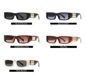 Detailed display of slim square sunglasses in multiple colors with gold metal accents