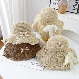 Girls wide brim straw sun hats with bows and cherry accents for summer beach outings