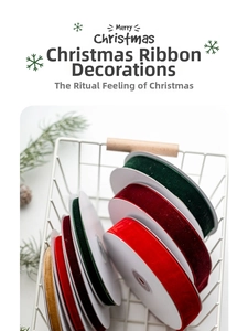 Detail of multi-color Christmas velvet ribbons neatly arranged in a white wire basket