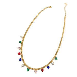 Golden Cuban chain necklace with colorful heart-shaped cubic zirconia charms on white background