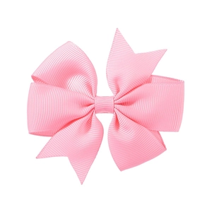 Detail of light pink ribbed grosgrain ribbon hair clip with double layered bow structure