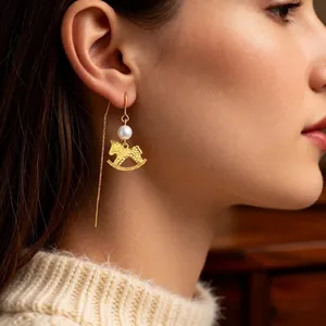 Elegant gold rocking horse earrings with pearls and long chain tassels for women