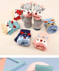 Detailed close-up of knitted flip top mittens for kids with plush fleece and cartoon animal patterns