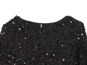 Detailed close-up of the round neckline on a stylish black sequin jacket garment