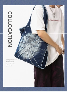 Detailed view of dark blue washed denim tote bag with raw edges and patchwork design