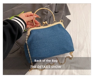 Rear view of denim handbag featuring vintage gold clasp and elegant metal chain strap