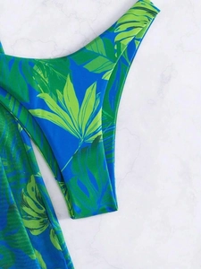 Detailed view of tropical green palm leaf print on high-elasticity bikini fabric