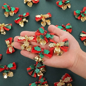 Close-up of DIY Christmas bells with plaid bows and berries for gift wrapping