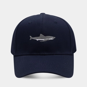 Classic navy cotton baseball cap with detailed white shark embroidery and curved brim