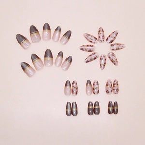 French cat-eye press-on nails with leopard patterns and gold lines in warm brown hues