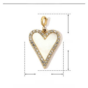 Detail view of heart shell pendant with dimensions 27mm by 16mm and stainless steel weight