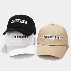 Classic cotton baseball caps with 1986 embroidery in black, white, and khaki colors