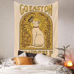 Bohemian Sphinx cat wall tapestry with sun and flower decor in a cozy bedroom scene