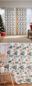 Detailed view of Christmas curtains featuring tree and snowflake patterns in festive red and green