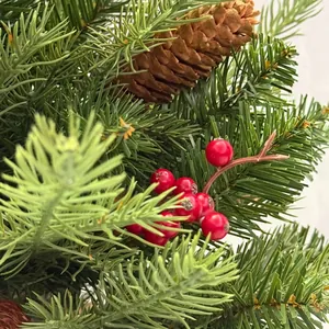 Mini Christmas tree ornament with realistic red berries and natural brown pine cones