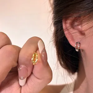 Minimalist double-layer U-shaped hoop earrings in gold and silver polished metal
