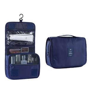 Blue hanging travel toiletry bag with waterproof compartments and foldable portable design