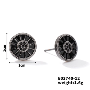Close-up of black zircon stud earrings with radial texture and 1cm size measurement