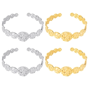 Detailed view of C-shaped stainless steel cuff bracelets with hammered metal texture in gold and silver