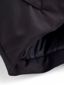 Detailed close-up showing black twill fabric texture and high-quality sewing craftsmanship