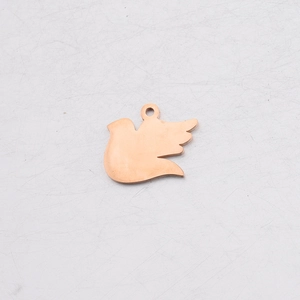 Detailed close-up of a rose gold dove pendant with a polished metallic mirror finish