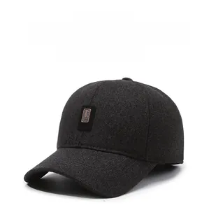 Detail of grey winter baseball cap with ear protection and warm thickened wool fabric