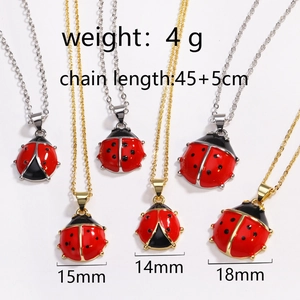 Detail showing ladybug pendant sizes 14mm to 18mm with gold and silver chains