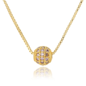 Detailed close-up of a gold box chain necklace with a pink zircon-studded spherical pendant