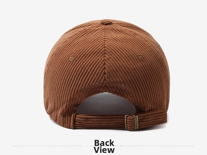 Rear view of brown corduroy baseball cap showing fine ribbed texture and adjustable strap
