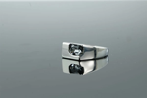 Close-up of rectangular grey gemstone set in a sleek silver metal ring for men