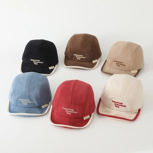 Collection of colorful cotton 5-panel camp caps with embroidered smiles and quotes