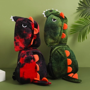 Detail of cute colorful tie-dye plush dinosaur backpacks with orange fins for kids