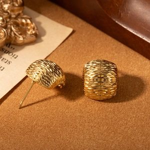 Elegant C-shaped stainless steel stud earrings with woven texture and gold finish